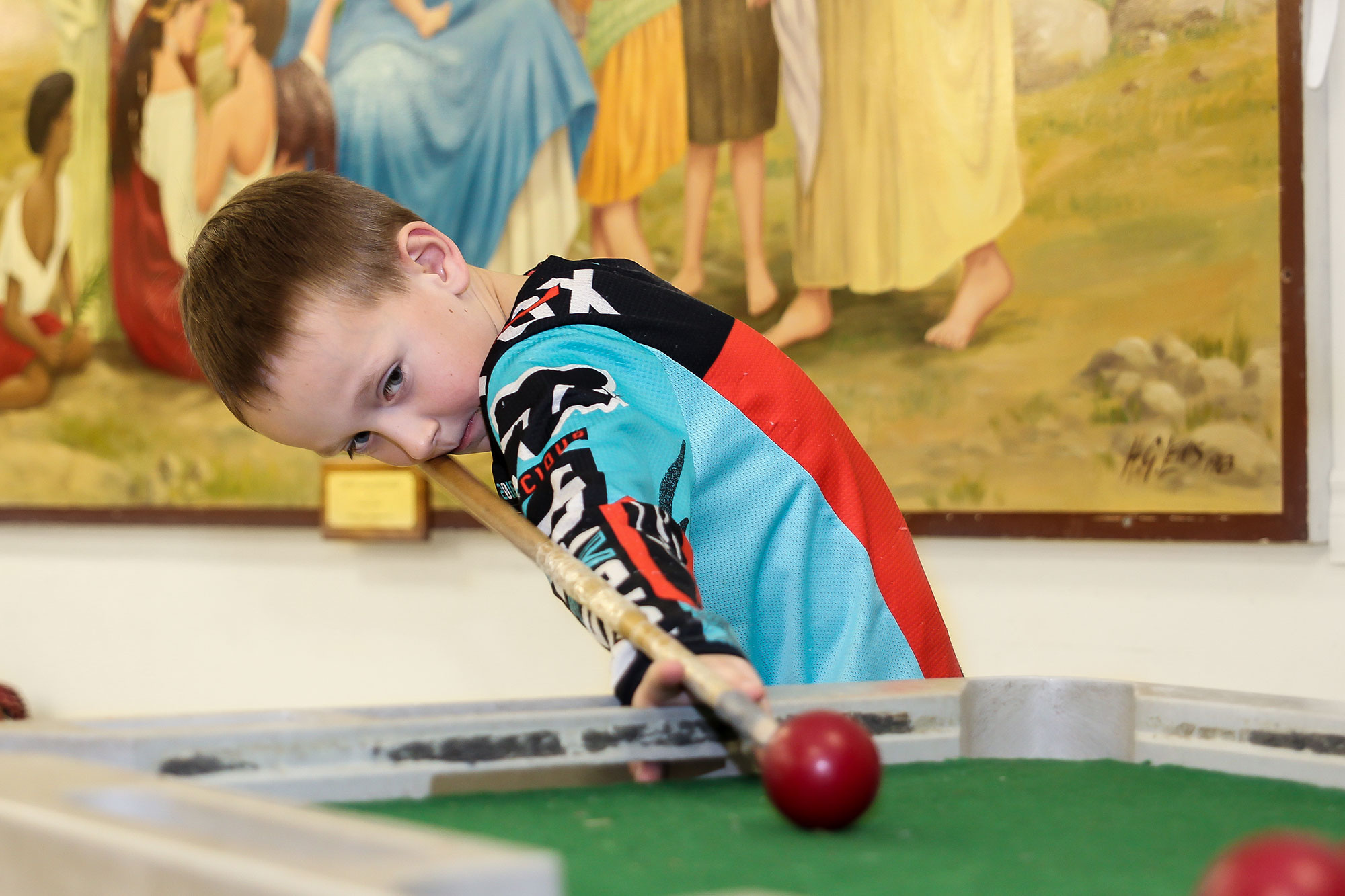 Boy playing pool